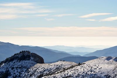 Scenic view of mountains against sky during winter