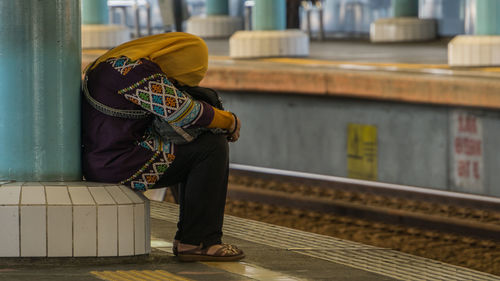 Man standing on railroad platform