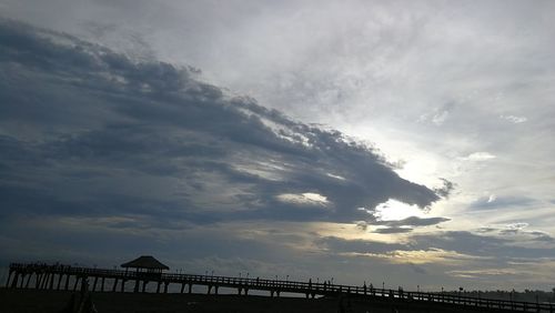 Low angle view of bridge against sky during sunset