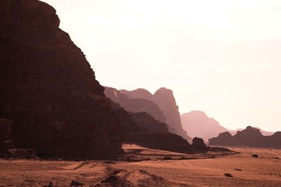 Rock formations on landscape against clear sky