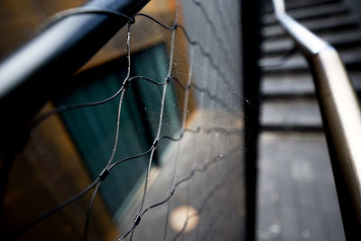 Close-up of broken spider web