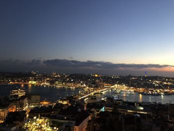 High angle view of illuminated buildings in city at night