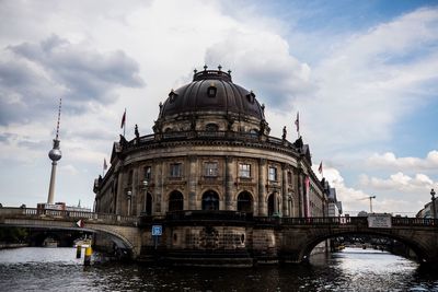 Low angle view of historical building against cloudy sky