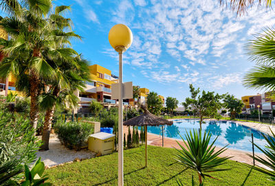 View of swimming pool against cloudy sky