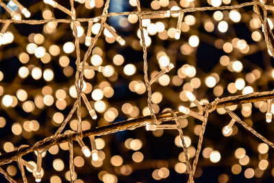 Close-up of illuminated christmas lights at night