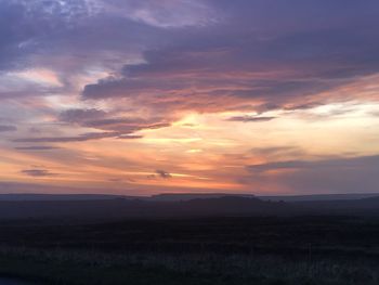 Scenic view of silhouette landscape against sky during sunset