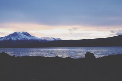 Scenic view of lake against sky during sunset