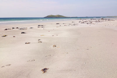 View of calm beach against the sky