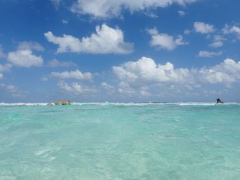 Scenic view of sea against blue sky