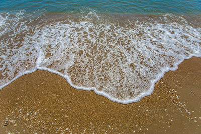 High angle view of surf on beach