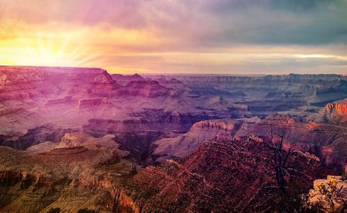 Scenic view of dramatic landscape during sunset