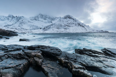 Scenic view of snowcapped mountains against sky