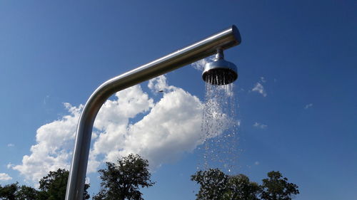 Low angle view of street light against sky