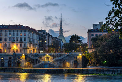 River po and the moleantonelliana at evening. turin, piedmont, italy.