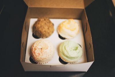 Close-up of cupcakes in cardboard box