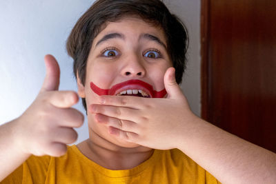 Portrait of boy holding camera