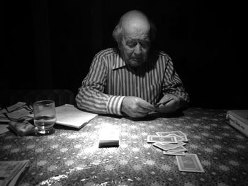 Portrait of man sitting on table