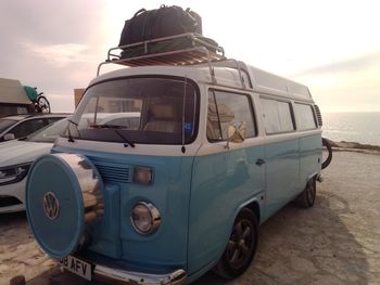 View of car on beach against sky