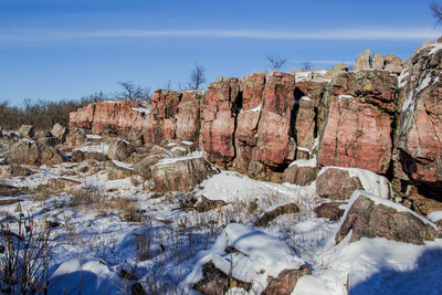 View of snow covered land against sky