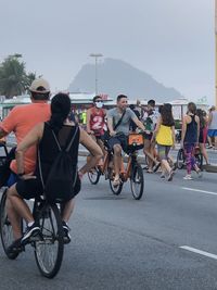 People riding bicycle on road