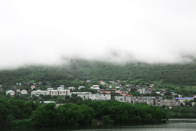 Buildings in city against sky