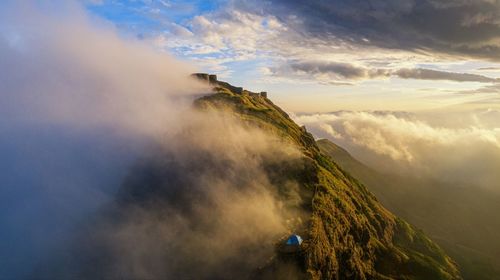 Panoramic view of mountain against cloudy sky