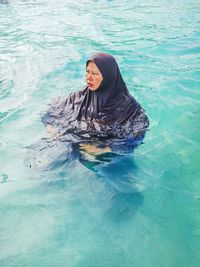 High angle view of woman swimming in pool