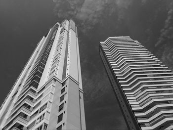 Low angle view of modern buildings against sky in city