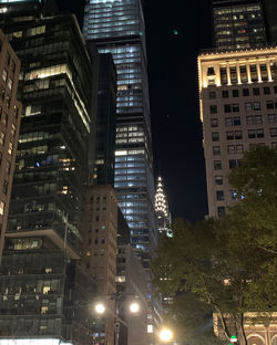 Illuminated buildings in city at night