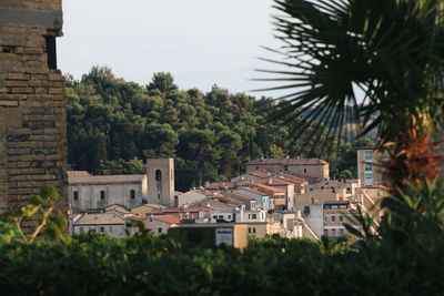 Houses in town against sky
