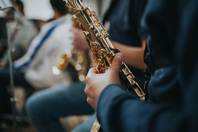 Midsection of people playing guitar