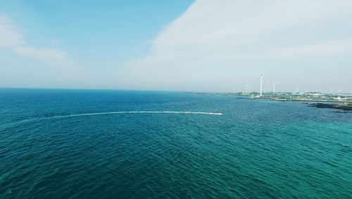 Scenic view of blue sea against sky