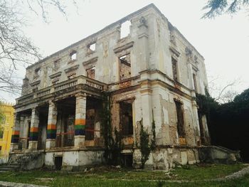 Low angle view of old building against sky
