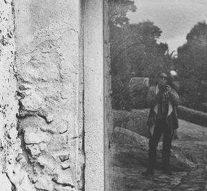 People standing against wall