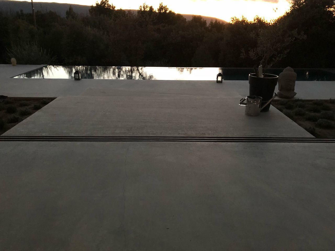 SCENIC VIEW OF SWIMMING POOL BY LAKE