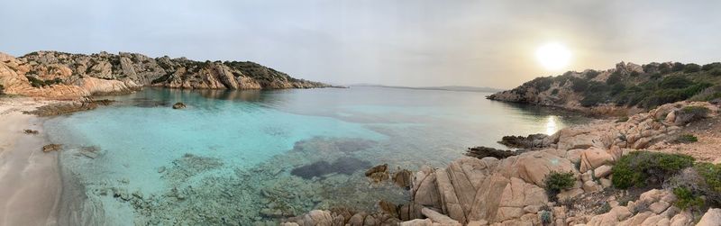 Panoramic view of sea and rocks against sky