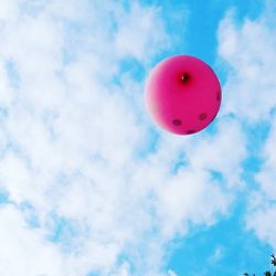 Low angle view of balloon against blue sky