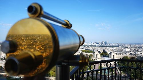 Close-up of cityscape against blue sky