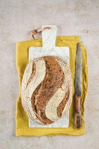 High angle view of bread on cutting board