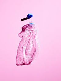 Plastic bottle on pink background