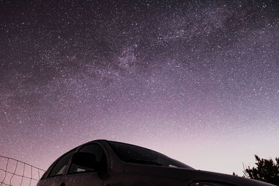 Low angle view of car against sky at night