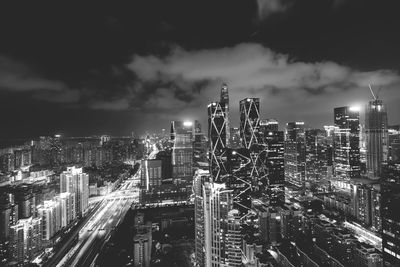 High angle view of illuminated city buildings at night