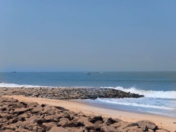 Scenic view of beach against clear sky