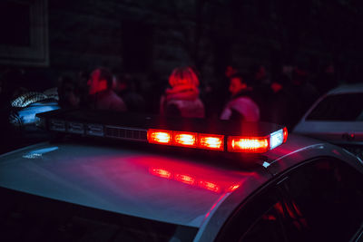 Illuminated siren on police car at night