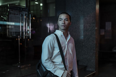 Portrait of young man looking at camera