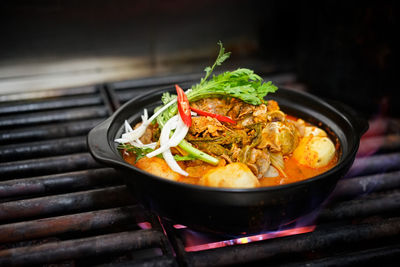 High angle view of fresh pork potato soup on barbecue grill