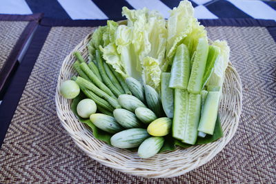 High angle view of vegetables in basket on table