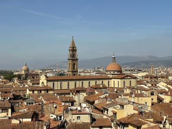 Buildings in city against sky