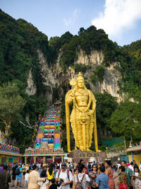 Statue of buddha against trees