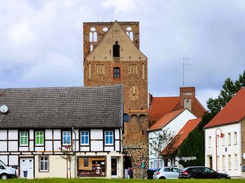 Houses in city against sky